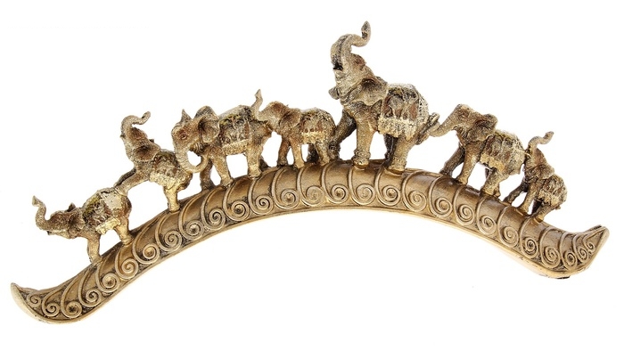 Сувенир Семь индийских слонов на дуге завитком